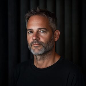 Authentic headshot portrait of a 45-year-old male electronic music producer