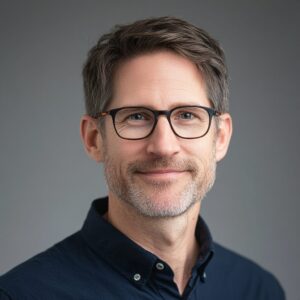 Corporate casual headshot of a 42-year-old male film composer